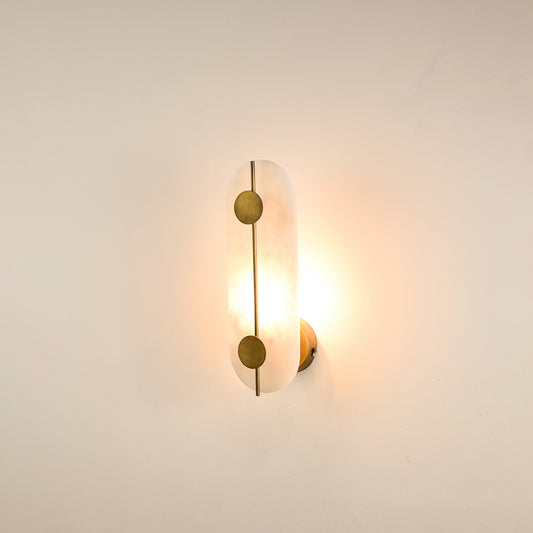 Modern marble wall light with warm ambient glow for elegant hallway and luxury decor styling spaces.
