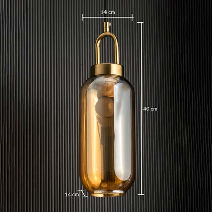 A gold and amber glass pendant light shown with 14 cm width 14 cm depth and 40 cm height measurements highlighting its slim tall modern silhouette.