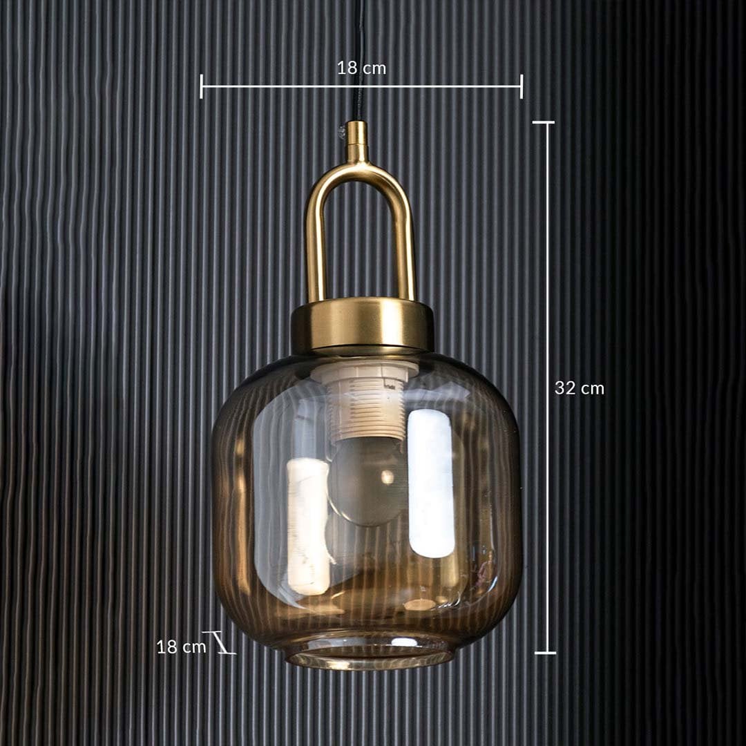 A gold and amber glass pendant light shown with 18 cm width 18 cm depth and 32 cm height measurements highlighting its compact modern design.