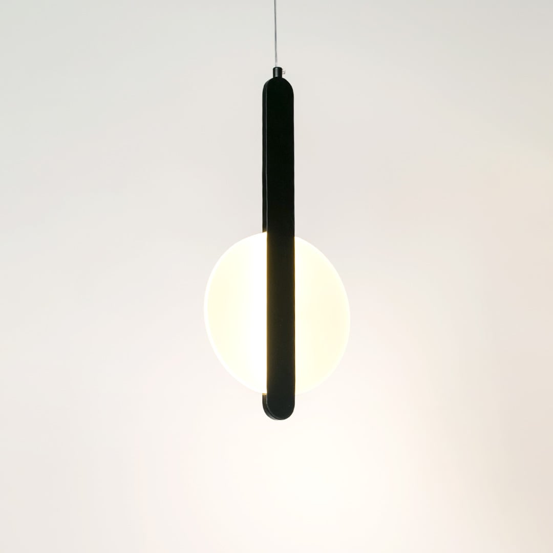 Modern geometric LED pendant light with black bar and white shade illuminated on white background for interiors.