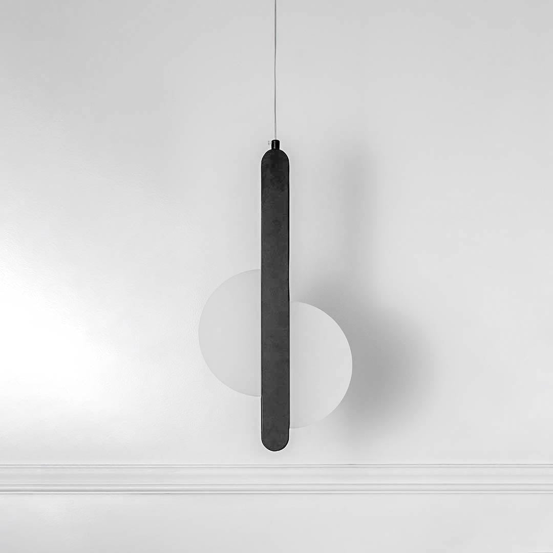 Slim black linear pendant light with minimalist design created for elegant dining and living spaces.