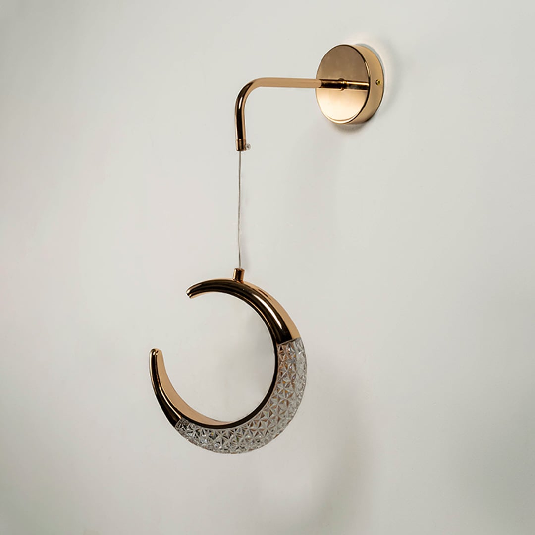 Crescent moon decorative pendant light with golden frame and crystal design shown unlit on white background.