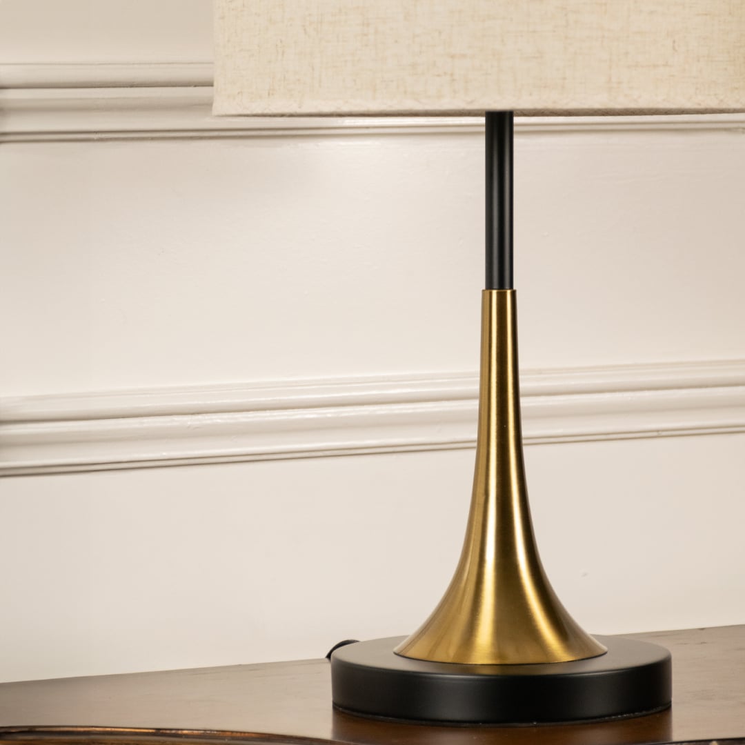 Halo closeup showing golden base and smoked glass dome shade designed for modern decorative table lamp home lighting setup.