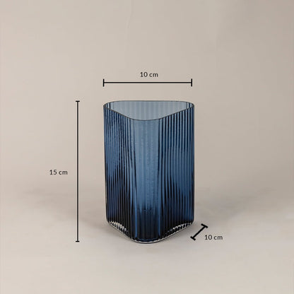 Ribbed blue glass vase with 15 cm height and 10 cm width shown on white background highlighting accurate product dimensions.