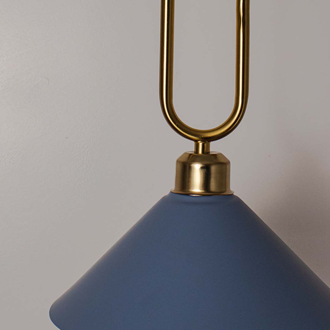 Closeup of blue conical pendant ceiling light with gold metal frame showing smooth finish and modern decorative ceiling style.
