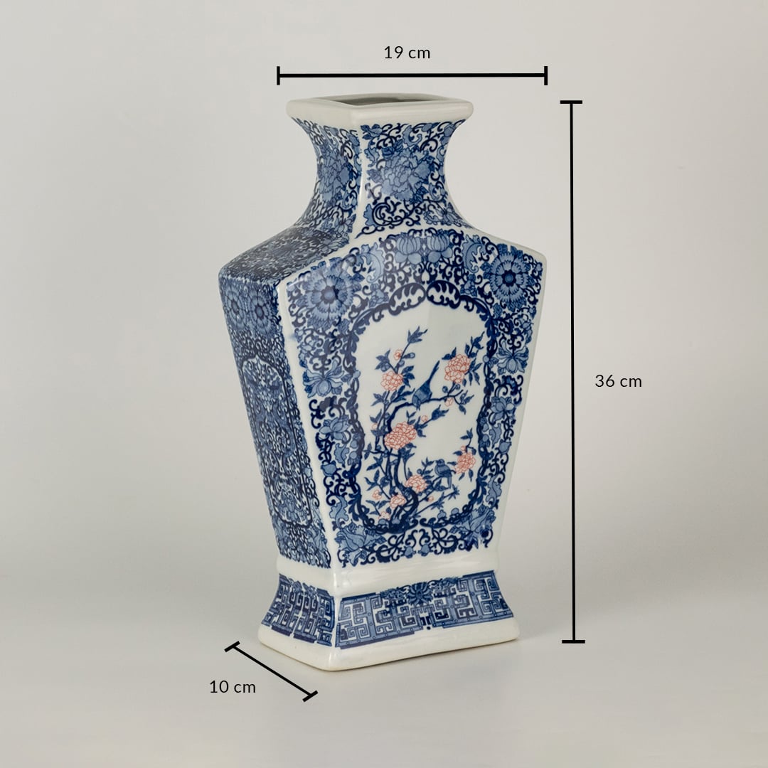 Blue and white ceramic decorative vase with floral artwork showing product dimensions for modern home decor displays.