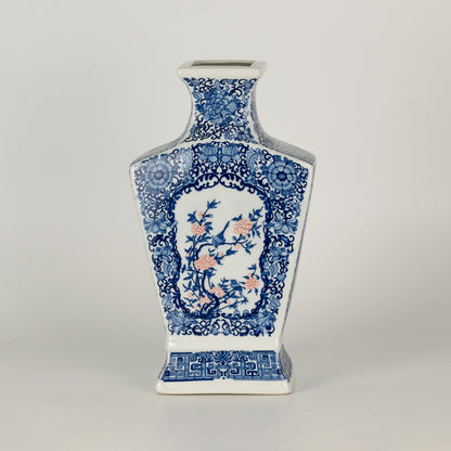 Blue and white ceramic decor vase with intricate pattern detailing ideal for living room table or shelf styling on clean background.