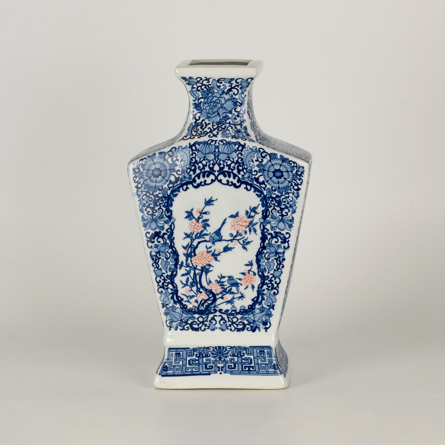 Blue and white ceramic decor vase with intricate pattern detailing ideal for living room table or shelf styling on clean background.