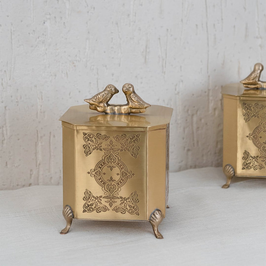 Gold metal decorative box elegantly packed inside a black box with secure cushioning for premium gifting.