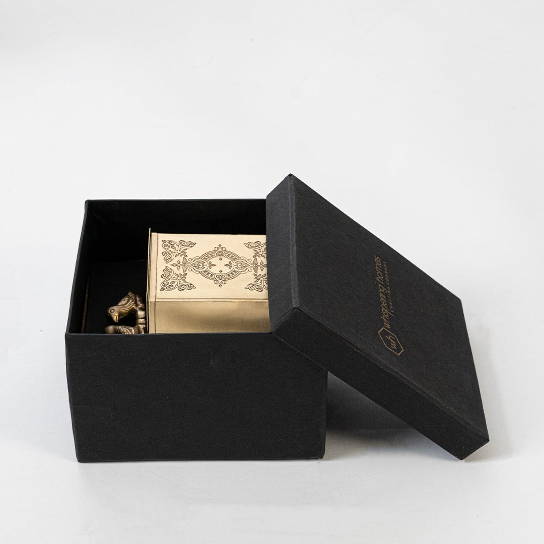 Decorative gold metal box displayed with measurement labels showing height width and depth for scale reference.