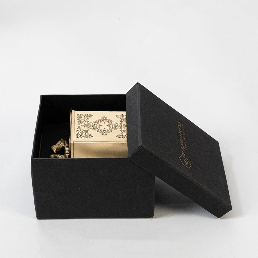 Decorative gold metal box displayed with measurement labels showing height width and depth for scale reference.
