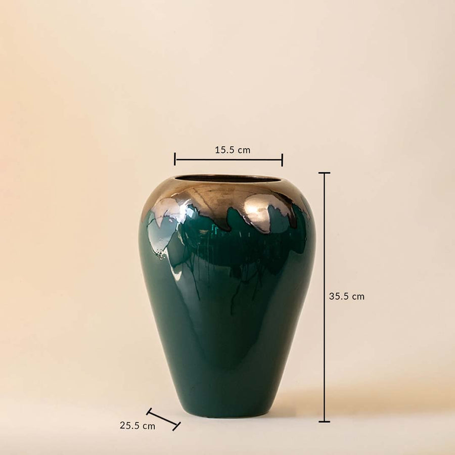 Tall green vase with gold toned upper section shown with height and width measurements on a plain background.