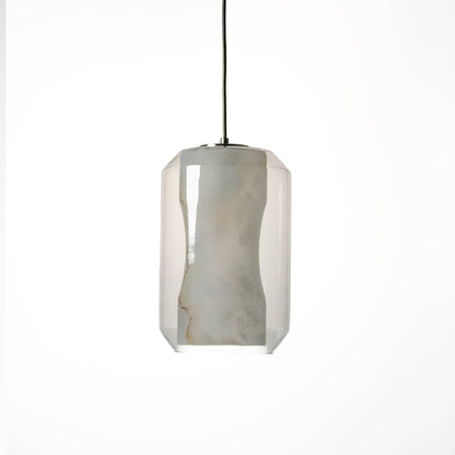 A glowing marble effect pendant light with transparent cylindrical glass body and soft warm illumination displayed on a clean white background for modern decor.