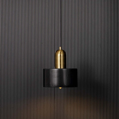 Elegant black and gold pendant ceiling light glowing warmly against black background adding luxury and charm to interiors.