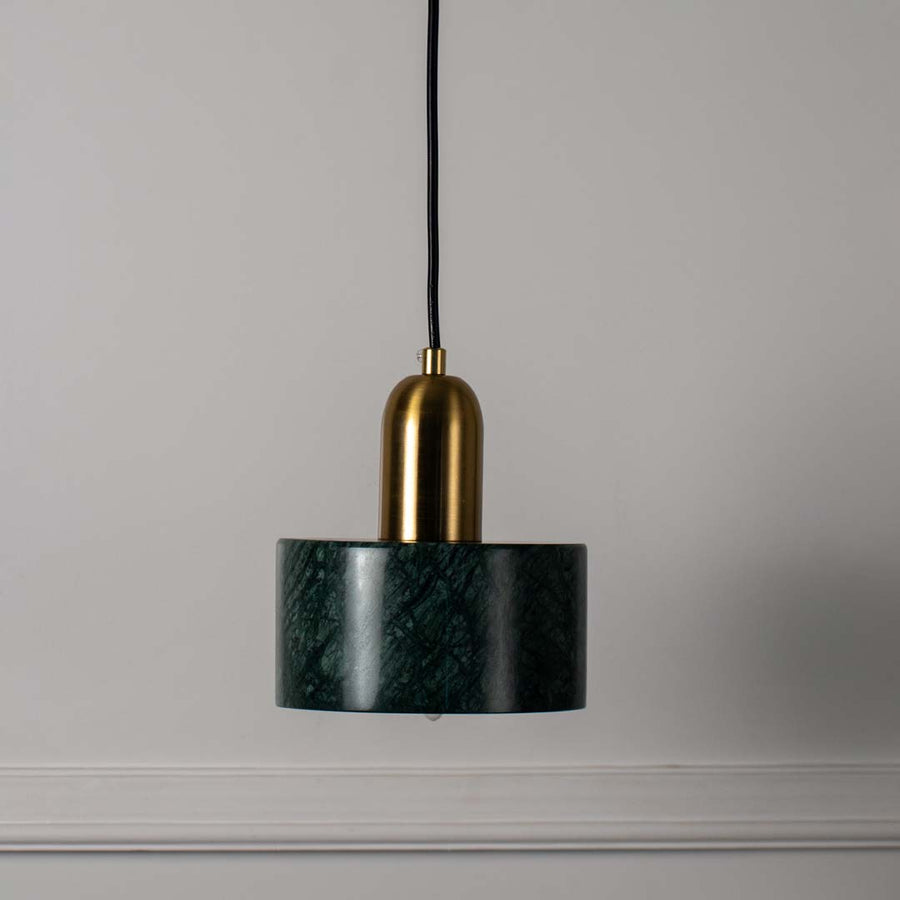 Modern green marble and gold pendant ceiling light featured on off white background adding luxury and elegance to interiors.