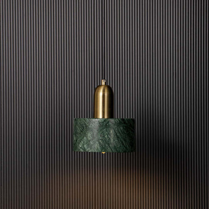 Stylish green marble and gold pendant ceiling light glowing beautifully against black background creating modern luxury vibe.