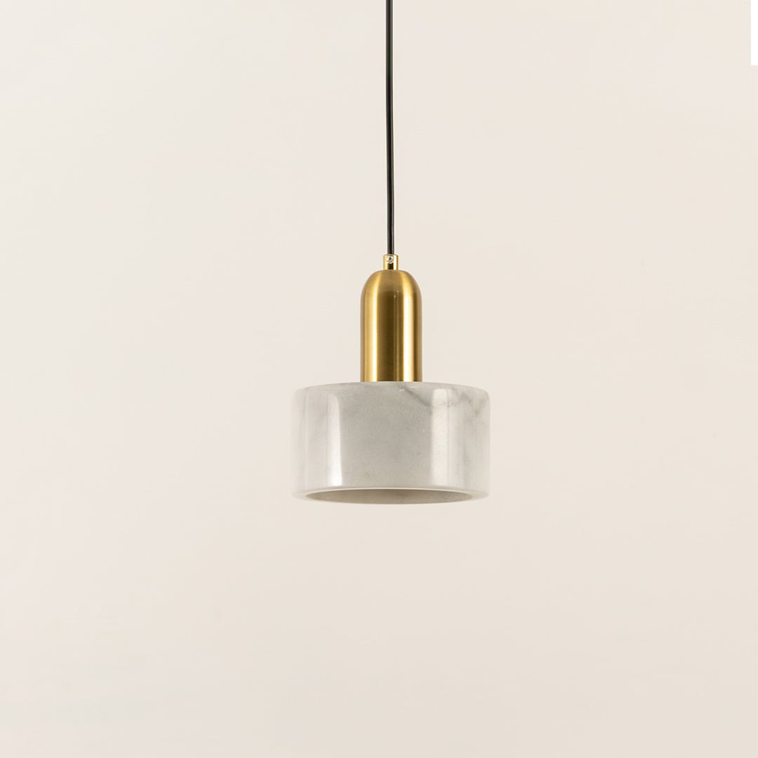 Minimalist white marble pendant light with cylindrical design created for elegant living spaces.