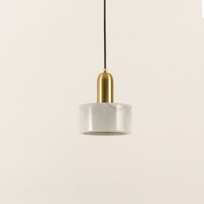 Minimalist white marble pendant light with cylindrical design created for elegant living spaces.