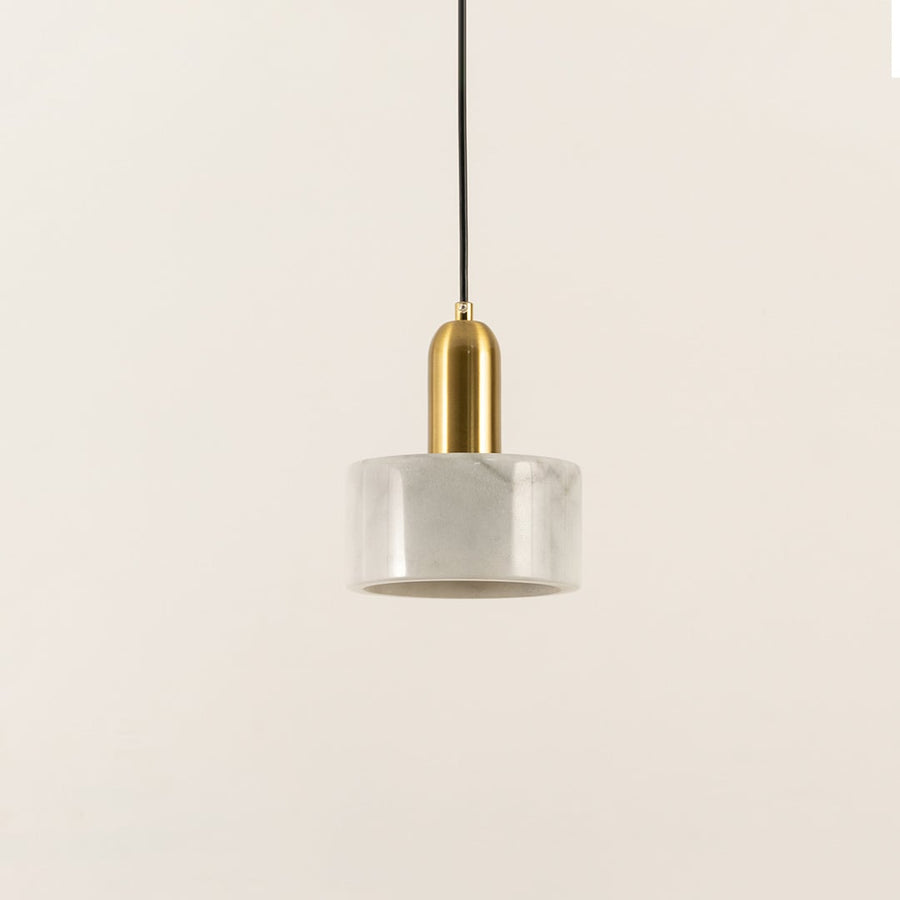 Minimalist white marble pendant light with cylindrical design created for elegant living spaces.