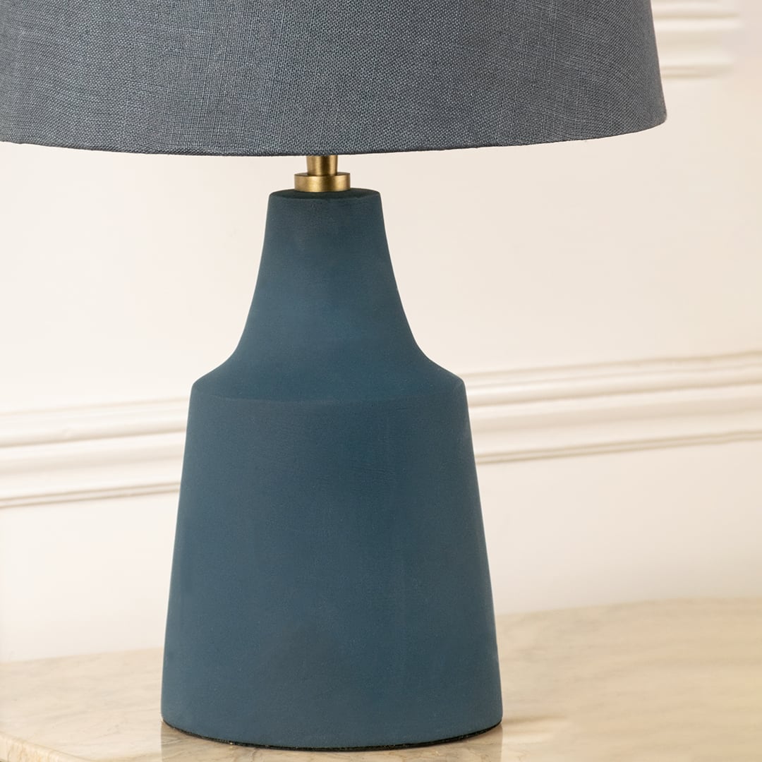 Blue ceramic table lamp base with matte finish and gold accent showcasing modern craftsmanship and elegant styling.