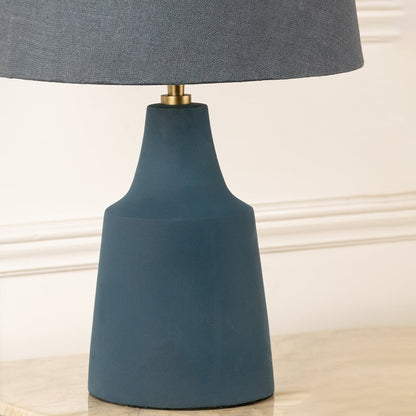 Blue ceramic table lamp base with matte finish and gold accent showcasing modern craftsmanship and elegant styling.