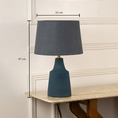 Blue ceramic table lamp with grey fabric shade measuring 47 cm height and 31 cm width for modern interiors.