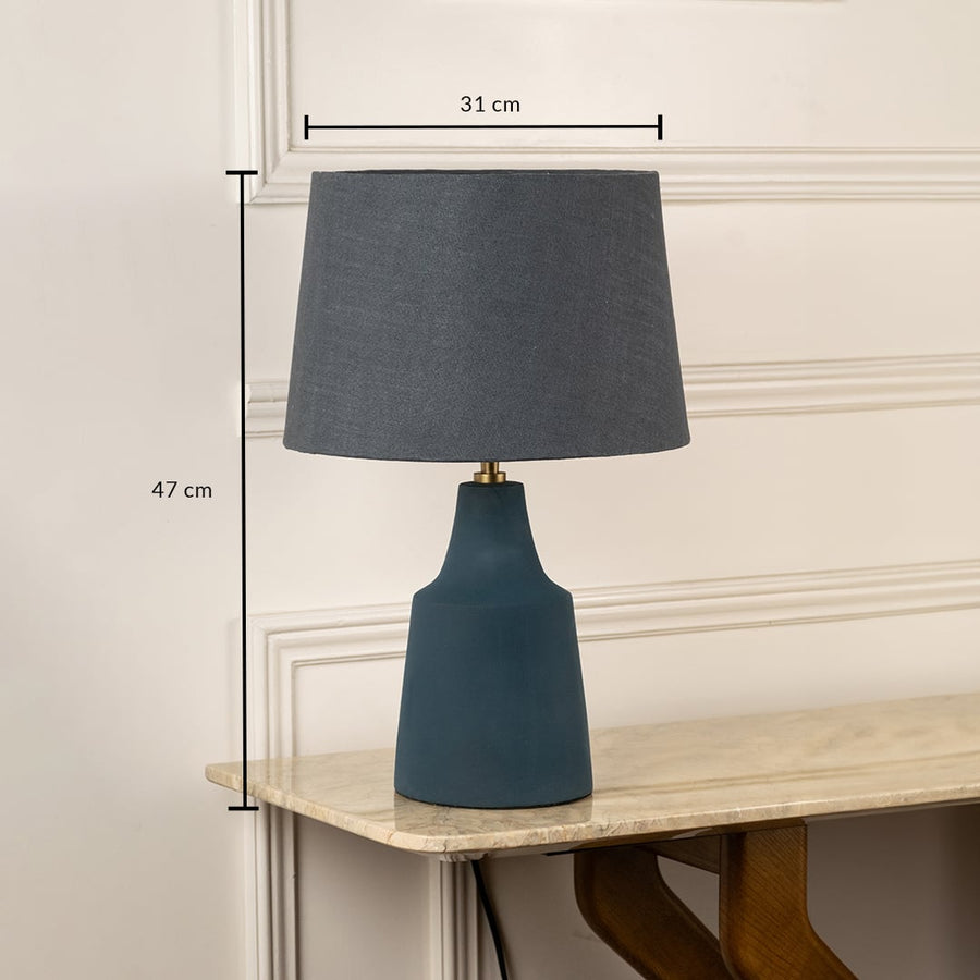 Blue ceramic table lamp with grey fabric shade measuring 47 cm height and 31 cm width for modern interiors.