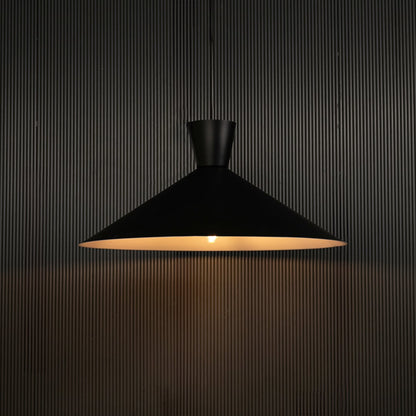 Black cone pendant light against dark panel wall with light on for stylish contemporary décor.