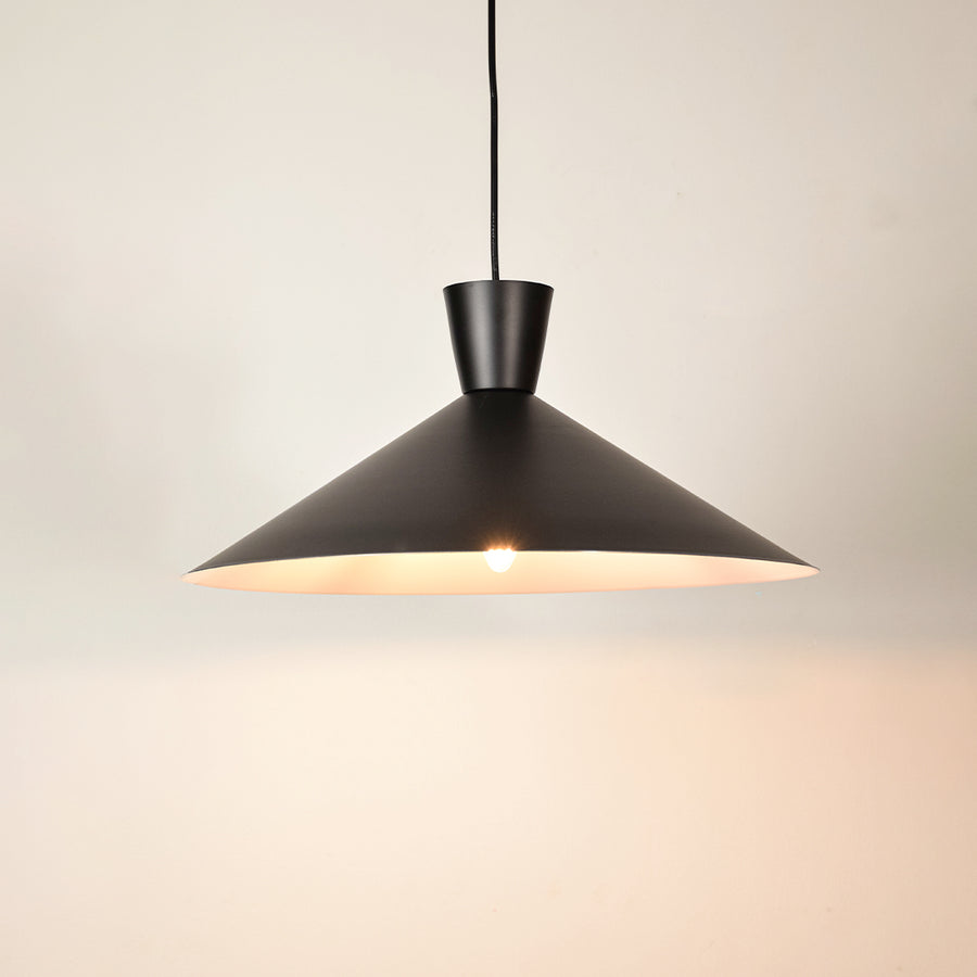 Black metal pendant light illuminated to display contemporary ceiling lighting with elegant minimalist design styling.
