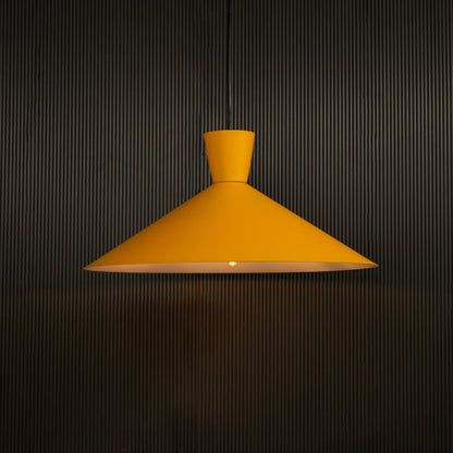 Yellow cone pendant light against dark panel wall with light on for bright modern décor.