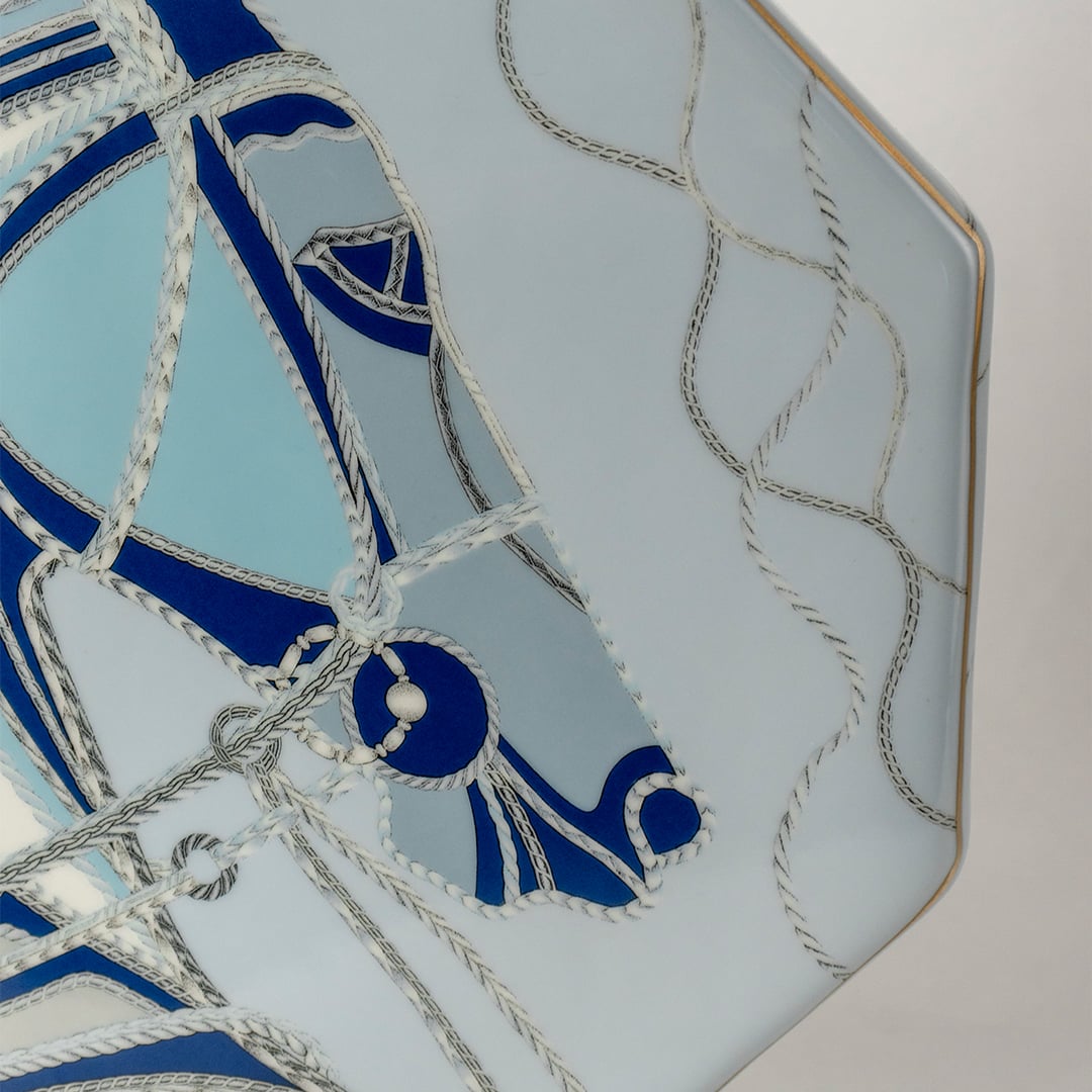 Octagon shaped ceramic jar with blue abstract equestrian artwork captured in a closeup view showing intricate brushstrokes fluid design and modern artistic décor suitable for stylish coastal homes.