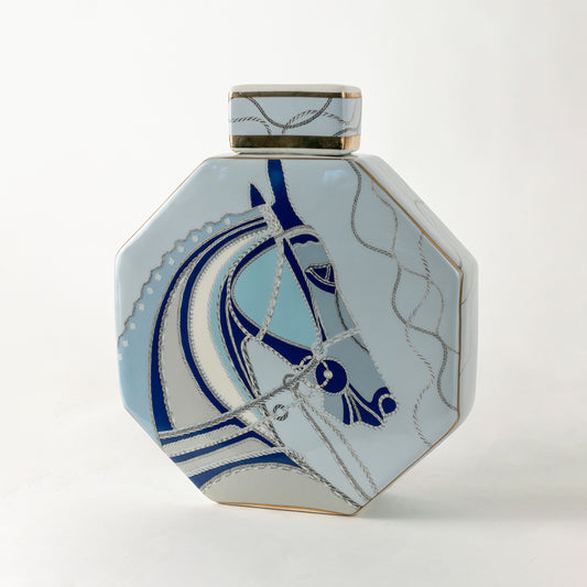 Blue and white ceramic decorative jar with abstract artwork for modern shelf styling and elegant home decor displays.