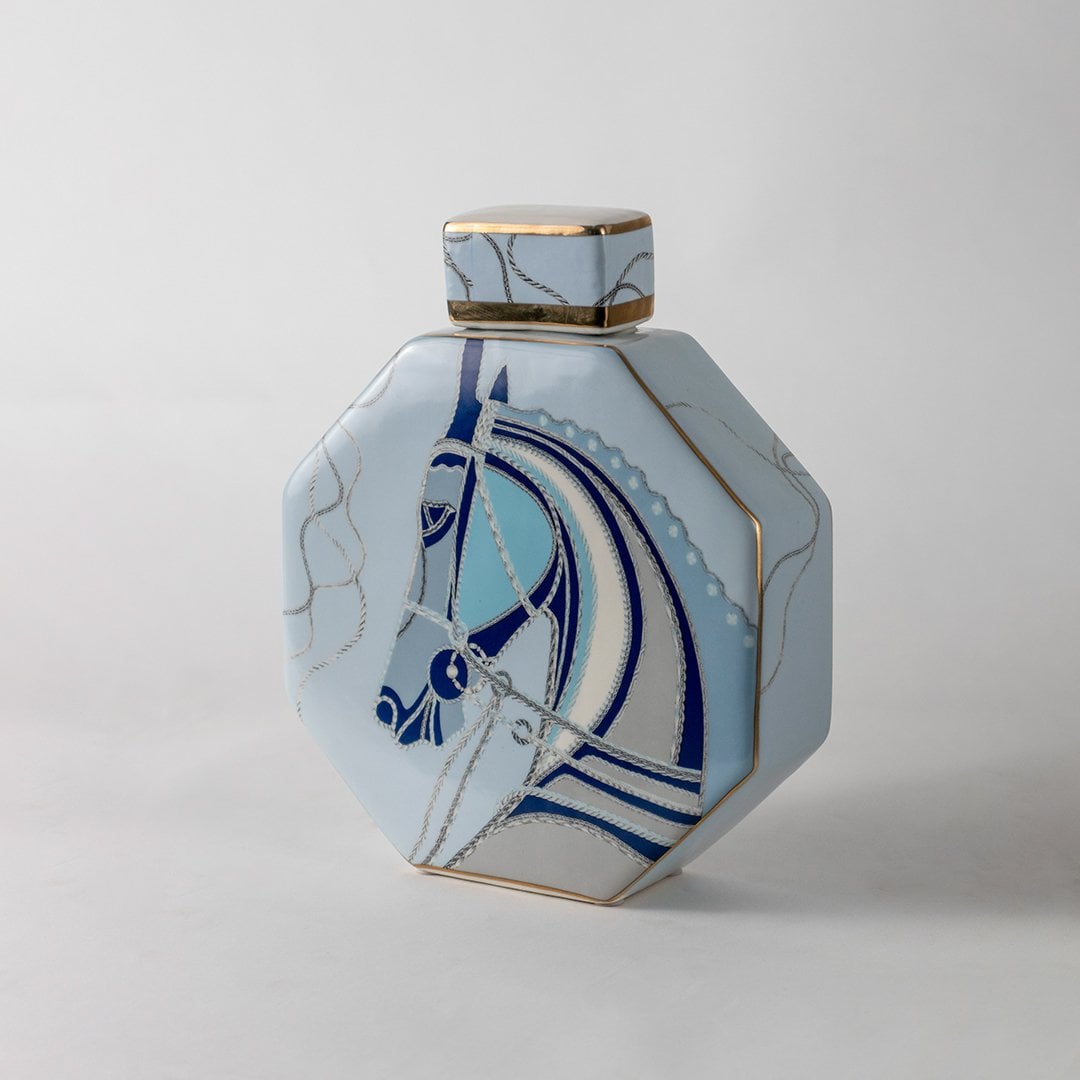 White octagon ceramic jar with blue abstract horse artwork in a front view perfect for artistic décor styling and modern console display.