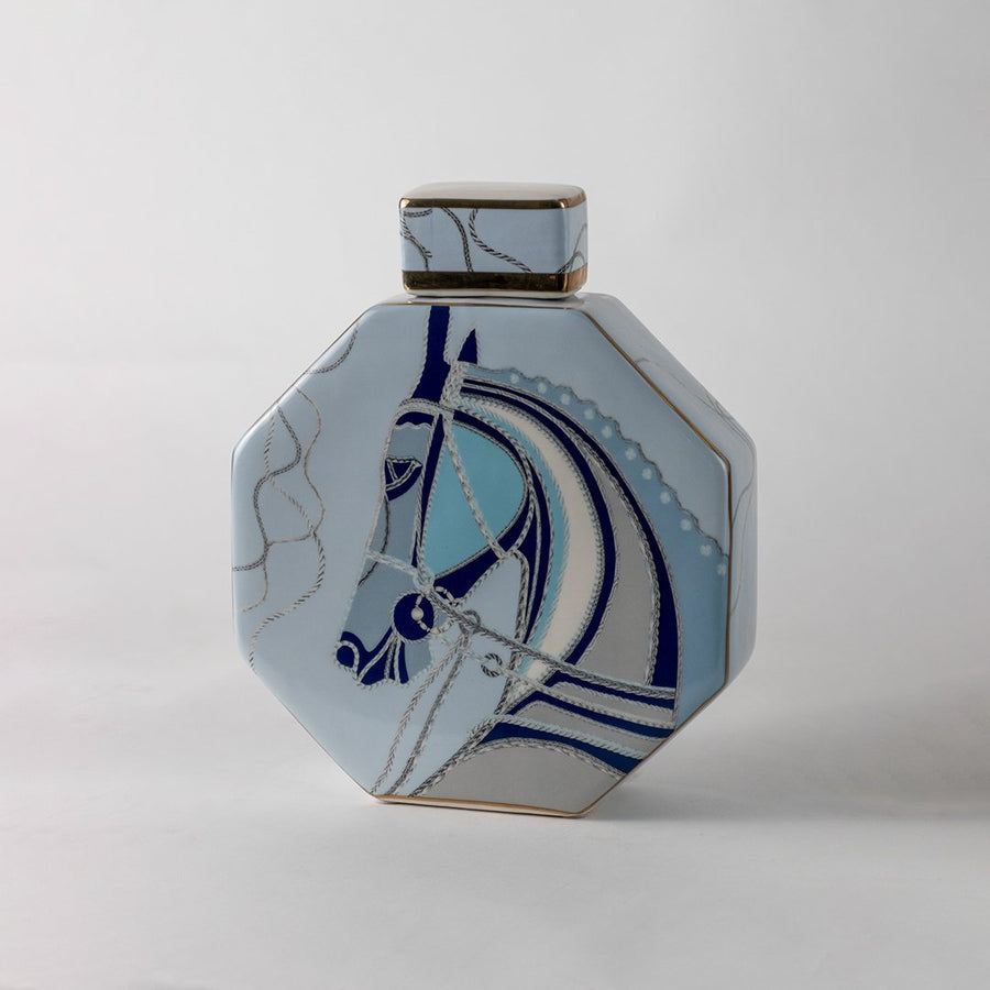 Blue and white ceramic decorative jar with abstract geometric artwork for contemporary shelf styling and home decor.
