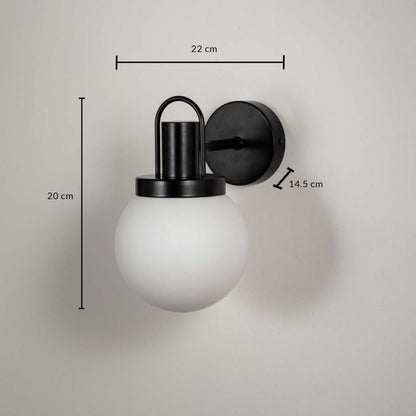 Frosted glass globe wall lamp with black metal base dimension 20 cm height 22 cm width 14.5 cm depth for living room decor.
