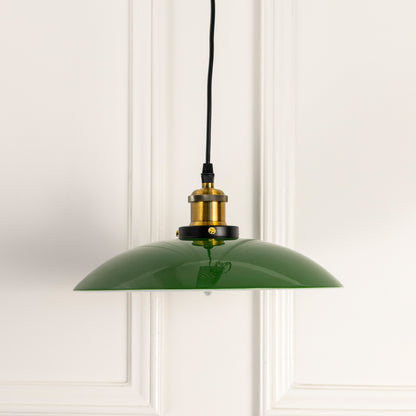 Glossy green metal pendant light with antique brass fittings crafted for kitchens and dining interiors.