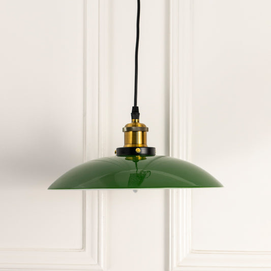 Glossy green metal pendant light with antique brass fittings crafted for kitchens and dining interiors.
