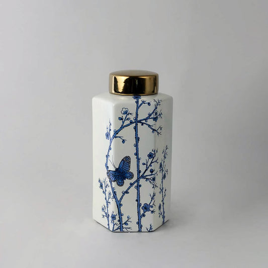 Elegant handcrafted ceramic decor jar with blue floral detailing and gold lid perfect for classic interior spaces.