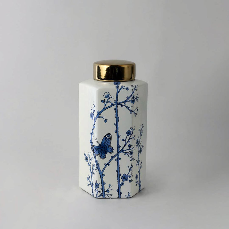 Elegant handcrafted ceramic decor jar with blue floral detailing and gold lid perfect for classic interior spaces.