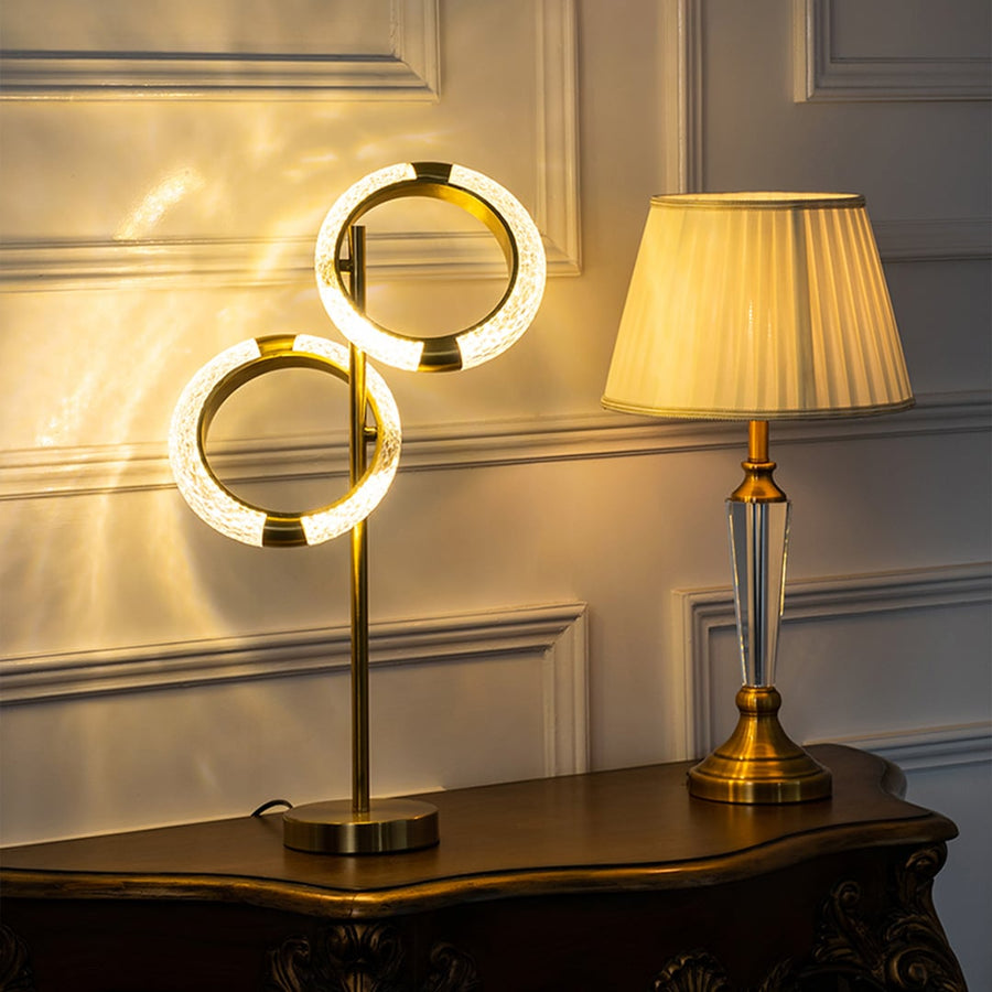 Grouped crystal ring table lamp with matching lighting pieces styled for coordinated luxury living room decor table lamp.