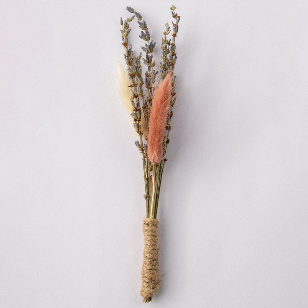 Handmade dried flower boutonniere with lavender stems pink preserved bloom and jute wrap perfect for groom wedding accessory.