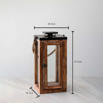 Tall wooden lantern dimensions 37.5cm height and 18.5cm width with rope handle and glass panels.