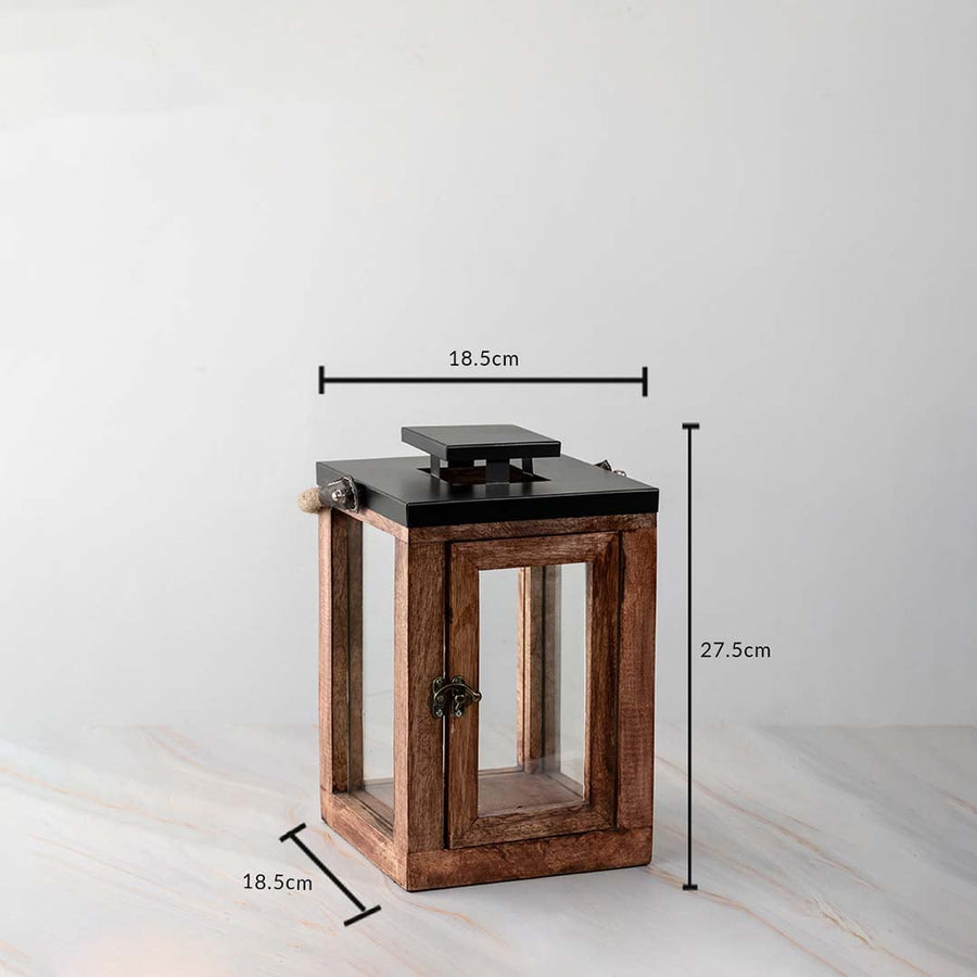 Rustic wooden lantern dimensions 27.5cm height and 18.5cm width with black top and glass panel sides.