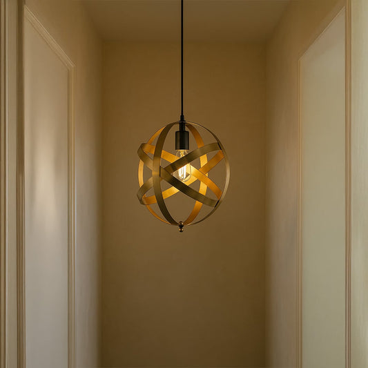 A metal pendant light with warm illumination hanging in a minimal hallway setting featuring soft beige walls and clean architectural lines.