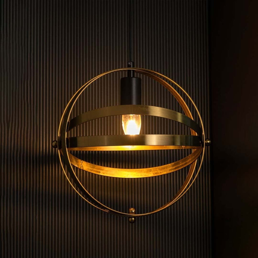 A spherical metal pendant light with warm illuminated filament displayed on a dark backdrop emphasizing the reflective metal bands and rounded structure.