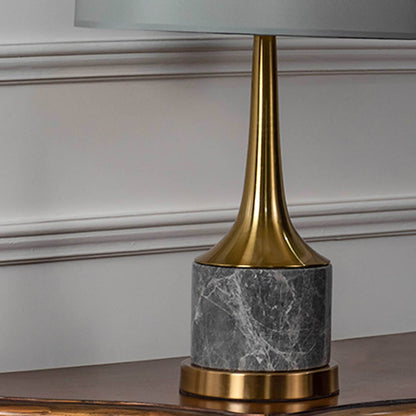 Grey marble base gold neck table lamp shown in close up view with light off for modern luxury décor styling.