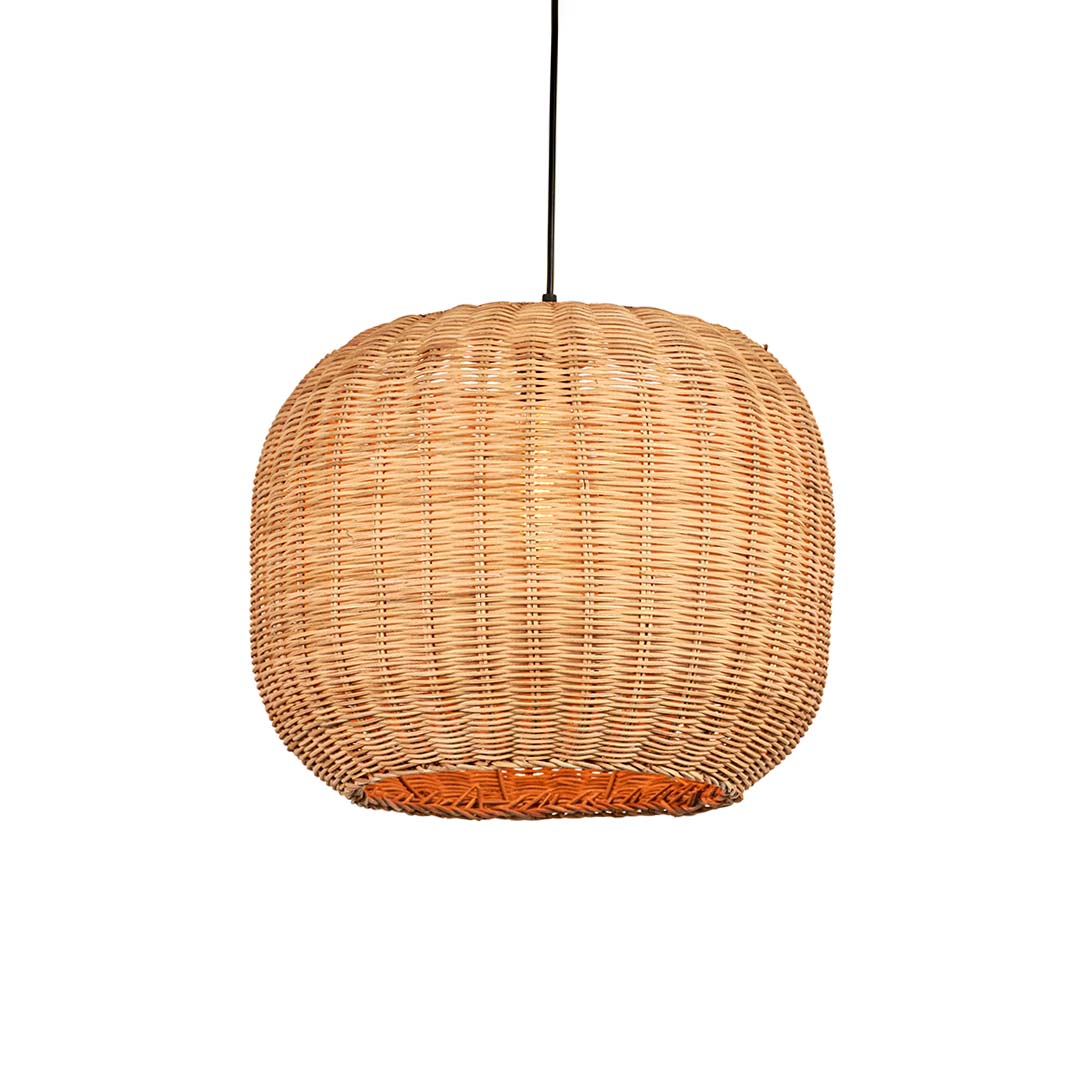Natural rattan pendant light with round globe shape and tight woven texture hanging against soft neutral wall background for warm modern decor.