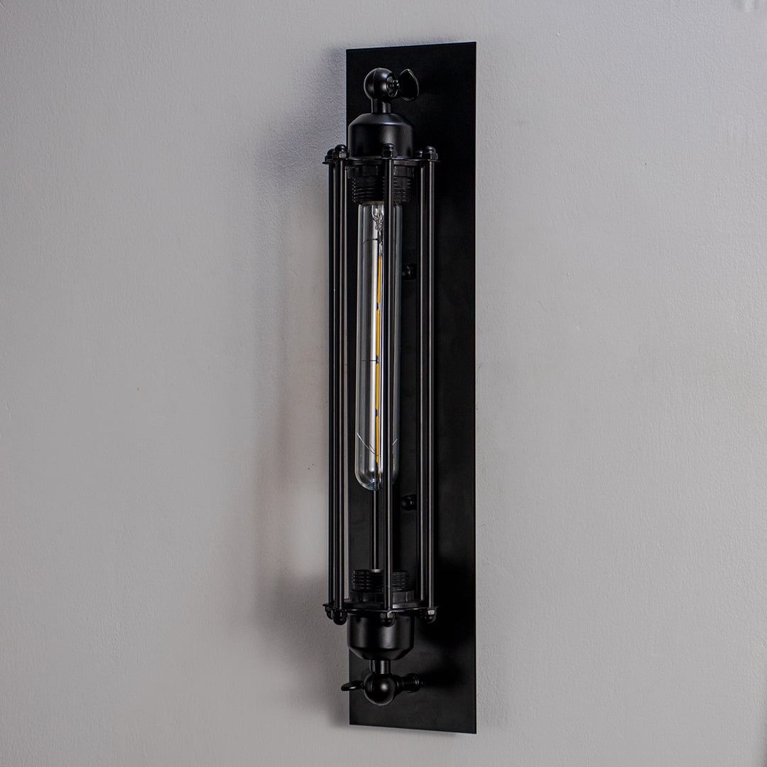 Wall sconce with industrial black metal tube cage frame perfect for bedroom living room and hallway modern loft interiors.