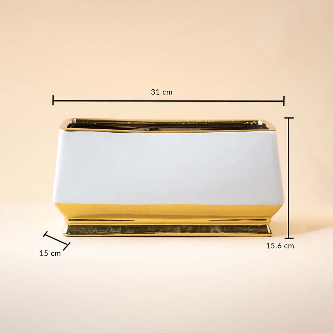 White rectangular ceramic vase with gold detailing shown with measurements of 31 cm length and 15.6 cm height against a soft beige backdrop emphasizing its sleek proportions.