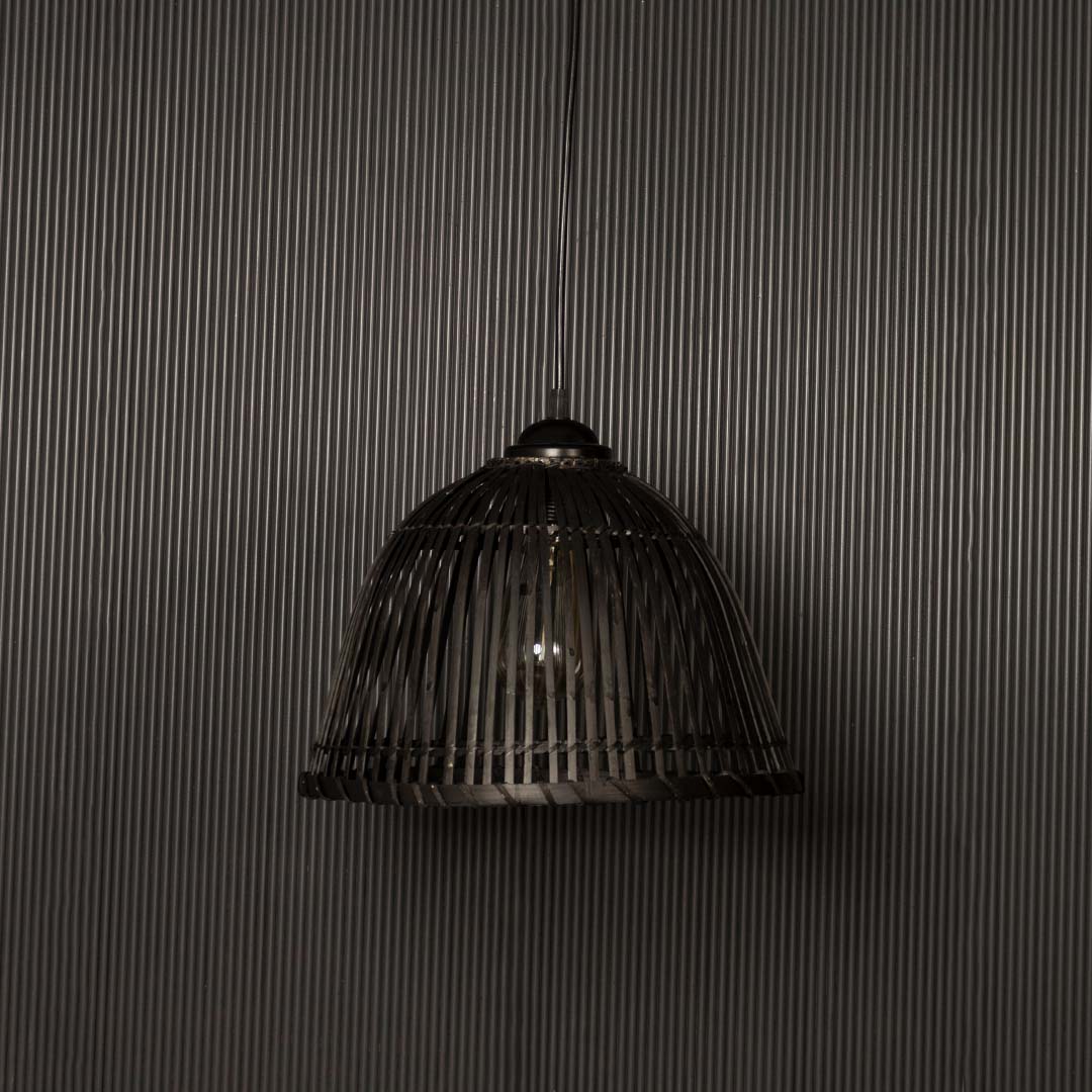 Elegant black rattan pendant lamp highlighted on dark background ideal for modern rustic interior styling.
